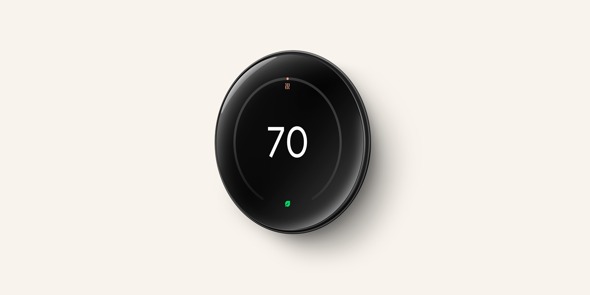Photo of a Nest thermostat displaying the current temperature and an automatic adjustment based on user habits.