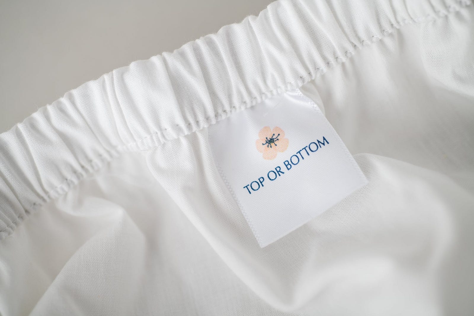 A tag at the bottom of a sheet, that reads 'Top or Bottom'